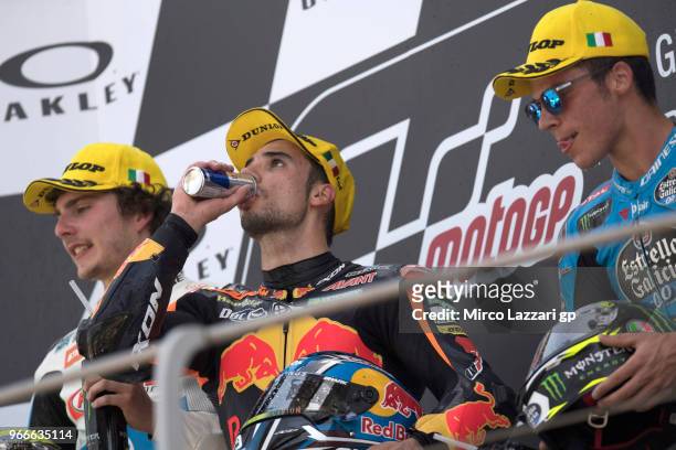 Lorenzo Balbassarri of Italy and Pons HP40, Miguel Oliveira of Portugal and Red Bull KTM Ajo and Joan Mir of Spain and EG 0,0 Marc VDS celebrate on...