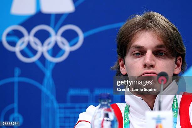 Figure skater Otar Japaridze of Georgia looks on as president Mikheil Saakashvili speaks during a press conference at the MPC on day two of the...