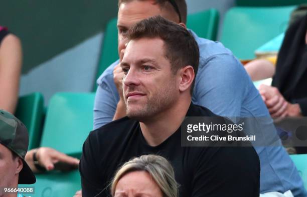 David Lee, fiance of Caroline Wozniacki of Denmark watches on as she faces Daria Kasatkina of Russia in the ladies singles fourth round match during...