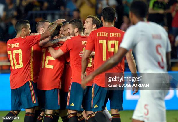 Spain players celebrate the opening goal during the international friendly football match between Spain and Switzerland at La Ceramica stadium in...