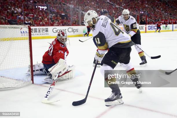Braden Holtby of the Washington Capitals tends goal against Pierre-Edouard Bellemare of the Vegas Golden Knights in Game Three of the 2018 NHL...