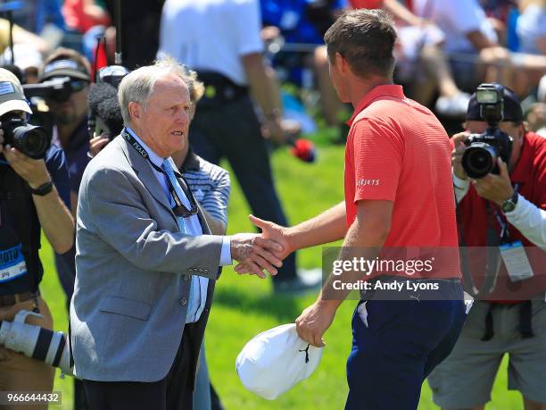 Bryson DeChambeau shakes hands with Jack Nicklaus after winning The Memorial Tournament Presented by Nationwide at Muirfield Village Golf Club on...