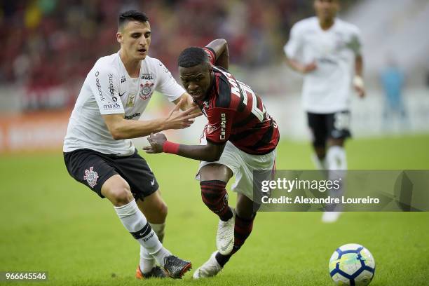 Vinicius Junior of Flamengo struggles for the ball with Mantuan of Corinthians during the match between Flamengo and Corinthians as part of...