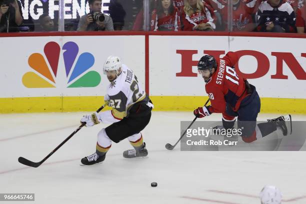 Shea Theodore of the Vegas Golden Knights skates against Chandler Stephenson of the Washington Capitals in Game Three of the 2018 NHL Stanley Cup...