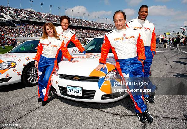 Patty Loveless, Bruce Jenner, Jim Belushi and Michael Strahan pose prior to the NASCAR Nationwide Series Drive4COPD 300 at Daytona International...