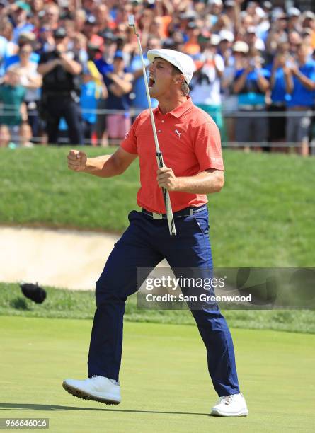 Bryson DeChambeau celebrates after winning in a playoff against Byeong-Hun An of South Korea during the final round of The Memorial Tournament...