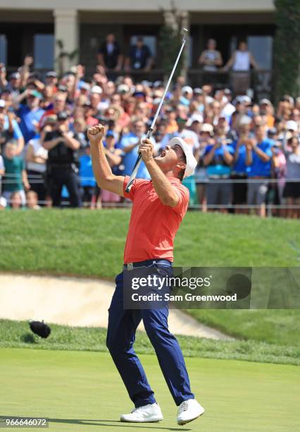 Bryson DeChambeau celebrates after winning in a playoff against Byeong-Hun An of South Korea during the final round of The Memorial Tournament...