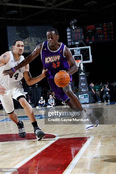 Earl Barron of the East All-Star team drives against Dwayne Jones of the West All-Star team during the NBA D-League All-Star Game on center court...