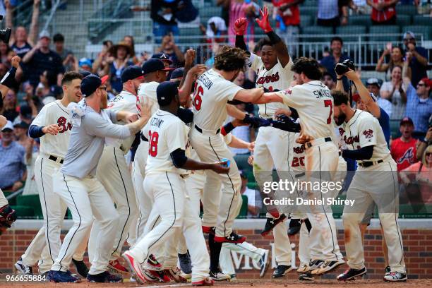 Charlie Culberson of the Atlanta Braves celebrates a walk off home run in the ninth inning against the Washington Nationals at SunTrust Park on June...