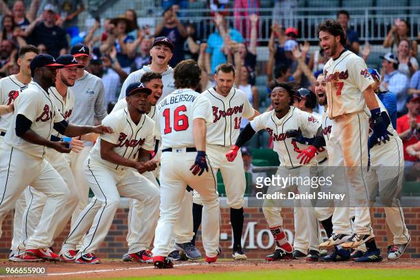 Charlie Culberson of the Atlanta Braves celebrates a walk off home run in the ninth inning against the Washington Nationals at SunTrust Park on June...