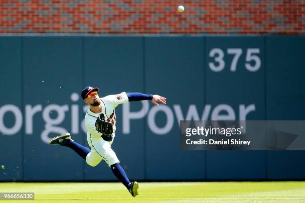 Ender Inciarte of the Atlanta Braves makes a diving catch during the eighth inning against the Washington Nationals at SunTrust Park on June 3, 2018...