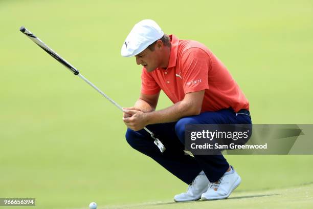 Bryson DeChambeau lines up a putt during the final round of The Memorial Tournament Presented by Nationwide at Muirfield Village Golf Club on June 3,...
