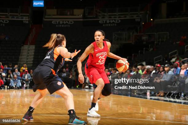 Monique Currie of the Washington Mystics handles the ball against the Connecticut Sun on June 3, 2018 at the Capital One Arena in Washington, DC....