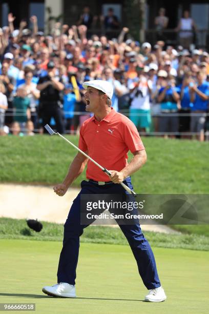 Bryson DeChambeau celebrates after winning in a playoff against Byeong-Hun An of South Korea during the final round of The Memorial Tournament...
