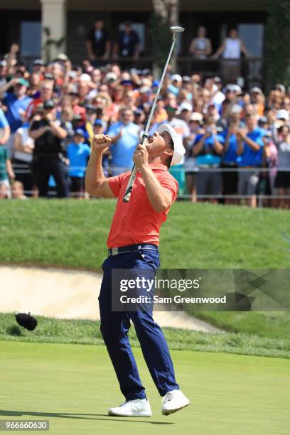 Bryson DeChambeau celebrates after winning in a playoff against Byeong-Hun An of South Korea during the final round of The Memorial Tournament...