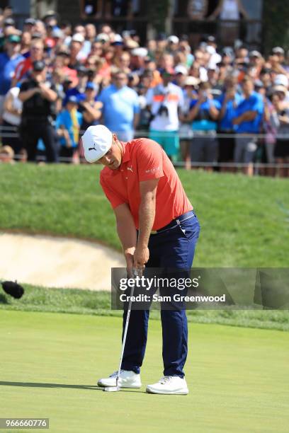 Bryson DeChambeau celebrates after winning in a playoff against Byeong-Hun An of South Korea during the final round of The Memorial Tournament...