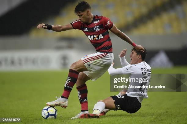 Lucas Paqueta of Flamengo struggles for the ball with Mateus Vital of Corinthians during the match between Flamengo and Corinthians as part of...
