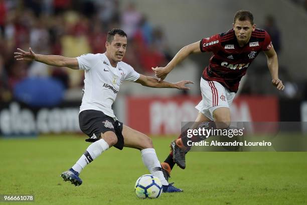 Jonas of Flamengo struggles for the ball with Rodriguinho of Corinthians during the match between Flamengo and Corinthians as part of Brasileirao...