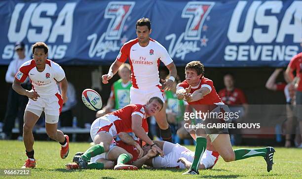 Lloyd Williams of Wales gives the ball in in front of Dan Norton of England during the 2010 USA Rugby Sevens tournament at the Sam Boyd Stadium in...