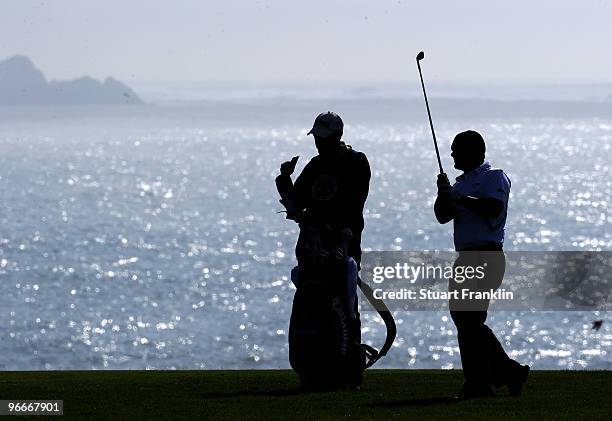 Alex Cejka of Germany plays his approach shot on the eighth hole during third round of the AT&T Pebble Beach National Pro-Am at Pebble Beach Golf...