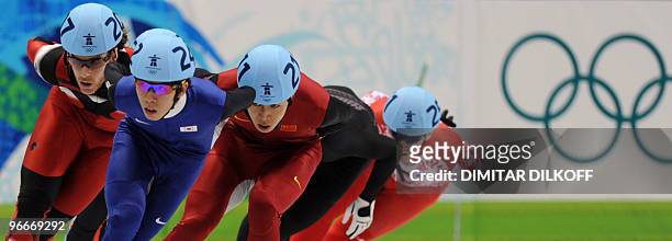 Canada's Olivier Jean , New Zealand's Blake Skjellerup , Xianwei Liu of China and Russia's Ruslan Zakharov compete in a men's 1,500m short-track...