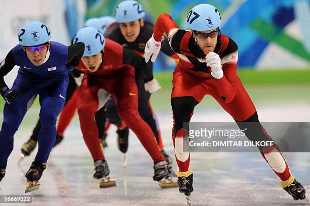 Canada's Olivier Jean leads ahead of New Zealand's Blake Skjellerup , Xianwei Liu of China anf Germany's Tyson Heung compete in a men's 1,500m...