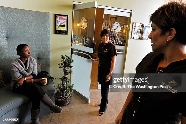 Rockville, MD Regular customer Tracey Scroggins, left, waits for her appointment with Julie Nguyen, center, at Blue Water spa in Rockville, Maryland....