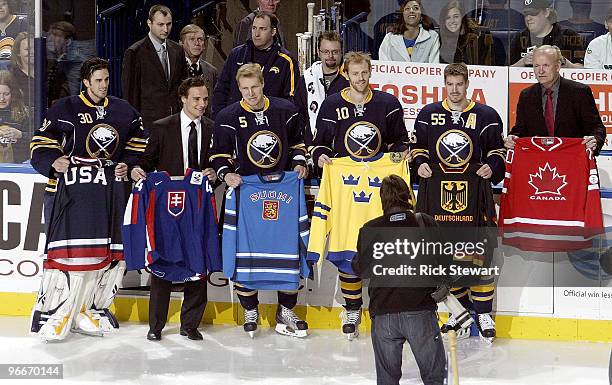 Ryan Miller, Andrej Sekera , Toni Lydman, Henrik Tallinder, Jochen Hecht and Lindy Ruff of the Buffalo Sabres display their respective Olympic...