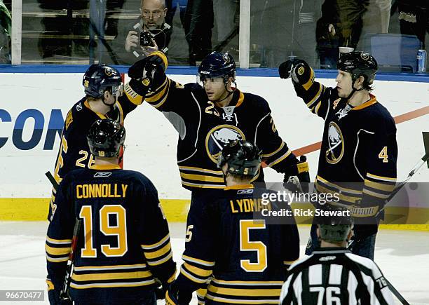 Thoams Vanek, Jason Pominville Steve Montador, Tim Connolly and Toni Lydman of the Buffalo Sabres celebrate Pominville's goal in the second period...