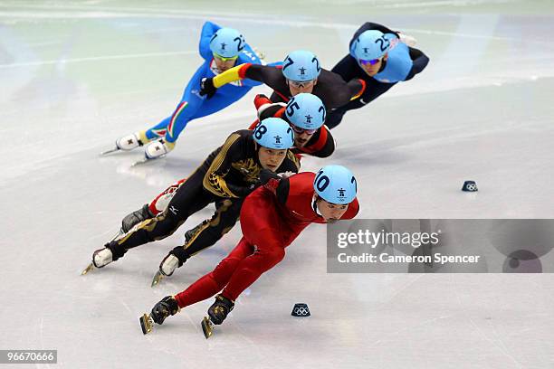 Liang Wenhao of China leads the pack in the Men's 1500 m Short Track on day 2 of the Vancouver 2010 Winter Olympics at Pacific Coliseum on February...