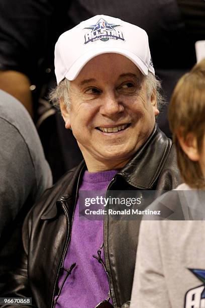 Singer/songwriter Paul Simon looks on during the Haier Shooting Stars Competition on All-Star Saturday Night, part of 2010 NBA All-Star Weekend at...