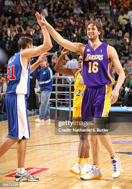 Brent Barry, Pau Gasol and Marie Ferdinand-Harris of Team Los Angeles high five during the Haier Shooting Stars contest on All-Star Saturday Night as...