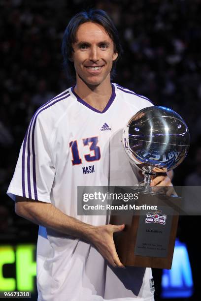 Steve Nash of the Phoenix Suns celebrates with the Champions Trophy after winning the Taco Bell Skills Challenge on All-Star Saturday Night, part of...