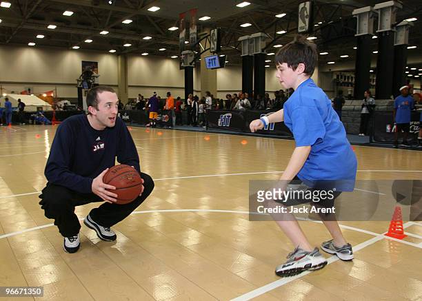 Blake Ahearn of the Bakersfield Jam encourages a participant during the Gatorade basketball clinic during Jam Session presented by Adidas during All...