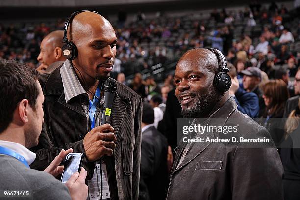 Jerry Stackhouse of the Milwaukee Bucks interviews NFL Legend Emmitt Smith courtside prior to the Haier Shooting Stars Competition as part of All...