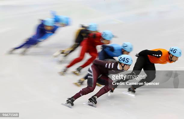 Niels Kerstholt of Netherlands and Haralds Silovs of Latvia lead the pack in the Men's 1500 m Short Track semifinals on day 2 of the Vancouver 2010...