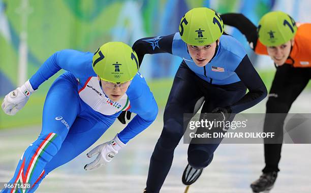 Italy's Arianna Fontana leads ahead of Alyson Dudek of the US and Annita van Doorn of the Netherlands during a women's 500m short-track qualifying...
