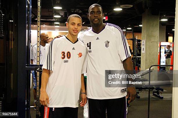 Stephen Curry of the Golden State Warriors and former NBA player Chris Webber pose for a picture prior to the Foot Locker Three Point Shootout during...