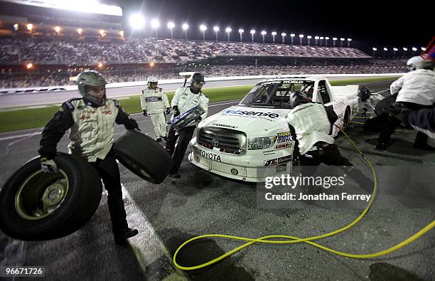 Nelson Piquet, driver of the Red Horse Racing Toyota, makes a pit stop during the NASCAR Camping World Truck Series Nextera Energy Resources 250 at...