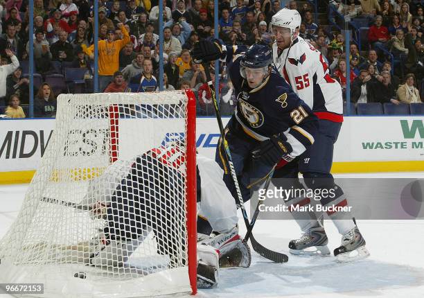 Patrik Berglund of the St. Louis Blues scores a goal on Jose Theodore of the Washington Capitals in front of Jeff Schultz on February 13, 2010 at...