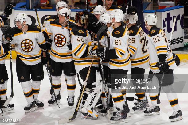 Goaltender Tuukka Rask of the Boston Bruins is congratulated by teammates after defeating the Florida Panthers in a shoot out on February 13, 2010 at...