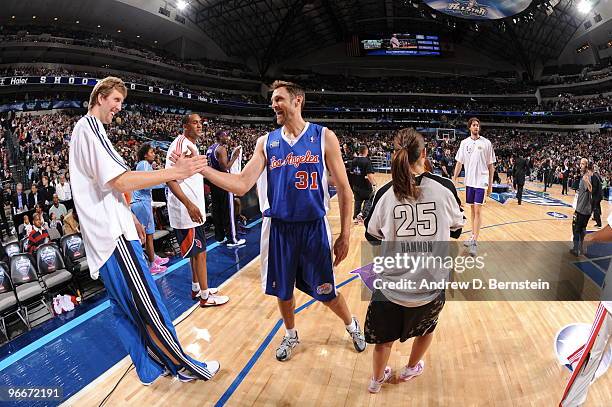 Dirk Nowitzki of Team Texas is congratulated by Brent Barry of Team Los Angeles during the 2010 Haier Shooting Stars on February 13, 2010 at the...