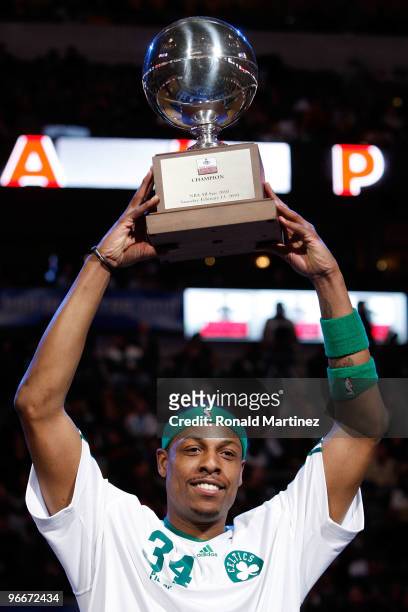 Paul Pierce of the Boston Celtics celebrates with the Champions Trophy after winning the Foot Locker Three Point Shootout on All-Star Saturday Night,...