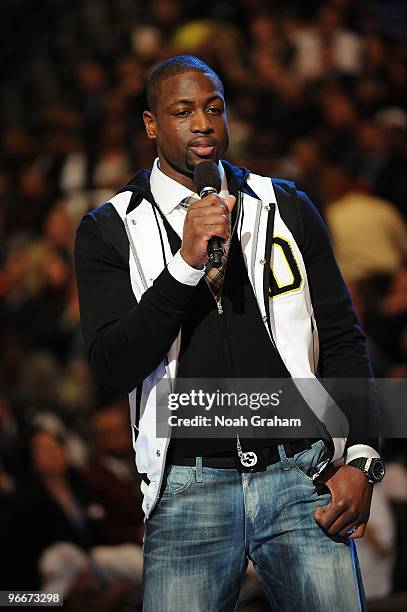 Dwyane Wade of the Miami Heat speaks on behalf of Haiti relief efforts during intermission of the Taco Bell Skills Challenge as part of All Star...