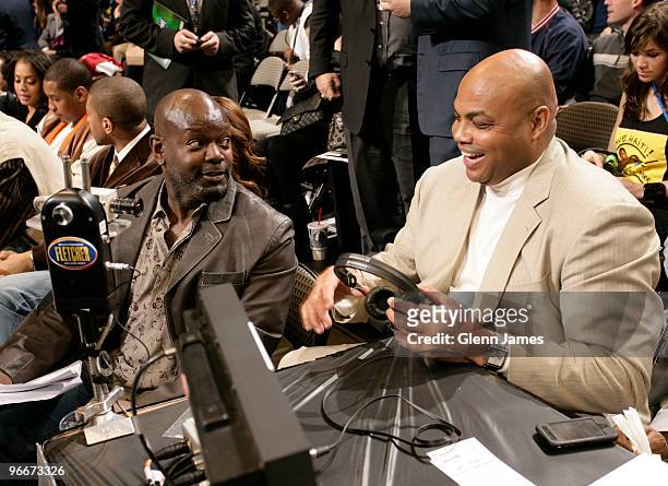 Hall of Famer Emmitt Smith and NBA Legend Charles Barkley share a laugh during the Foot Locker Three Point Contest on All-Star Saturday Night as part...