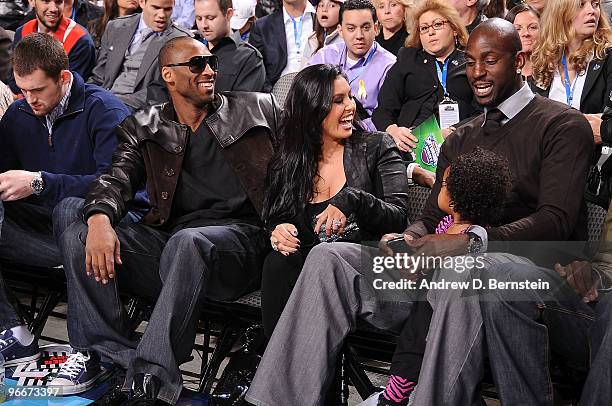 Kobe Bryant of the Los Angeles Lakers and Kevin Garnett of the Boston Celtics sit sideline during the Haier Shooting Stars Competition as part of All...