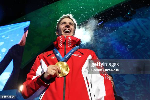 Simon Ammann of Switzerland celebrates with his gold medal during the Medal Ceremony for the Ski Jumping Normal Hill Individual on day 2 of the...