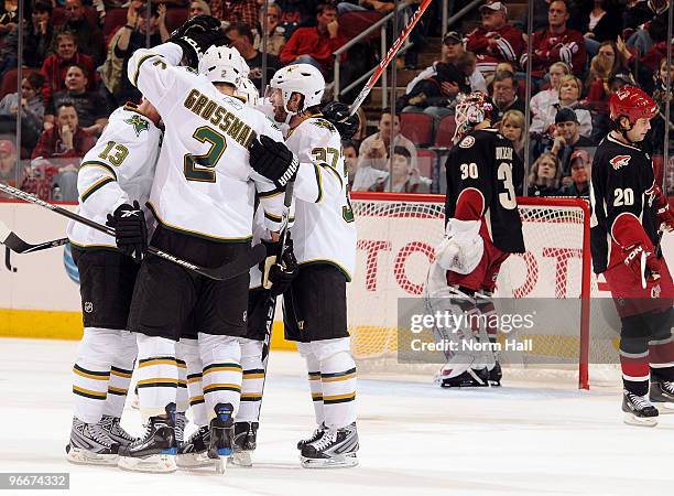 Nicklas Grossman, Krystofer Barch and Karlis Skrastins of the Dallas Stars celebrate a goal in front of Ilya Bryzgalov of the Phoenix Coyotes on...