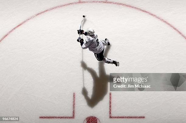 Kurtis Foster of the Tampa Bay Lightning warms up before playing against the New York Islanders on February 13, 2010 at Nassau Coliseum in Uniondale,...
