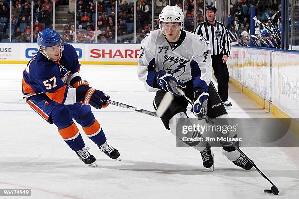 Victor Hedman of the Tampa Bay Lightning skates against Blake Comeau ofthe New York Islanders on February 13, 2010 at Nassau Coliseum in Uniondale,...